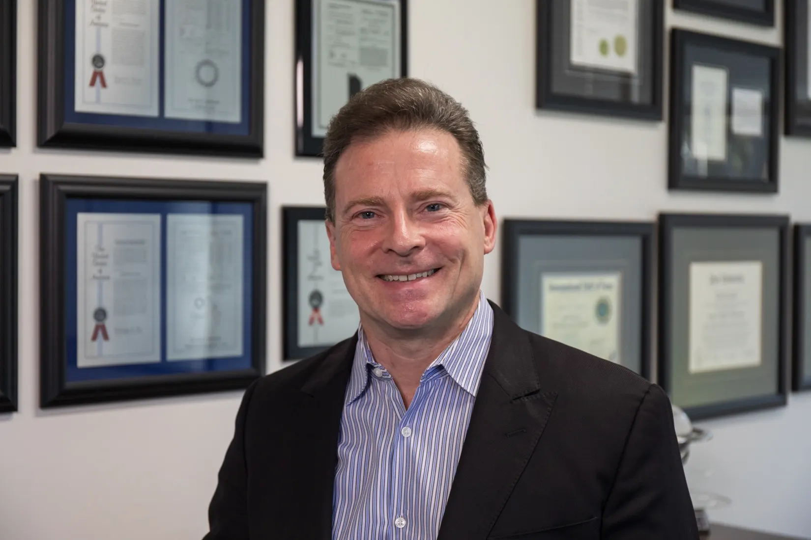 David Schmidt CEO & Patent Wall